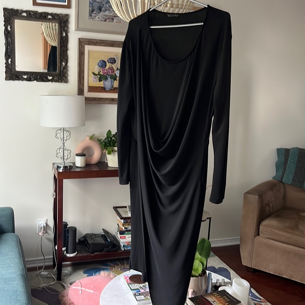 Long sleeved black faux wrap dress.